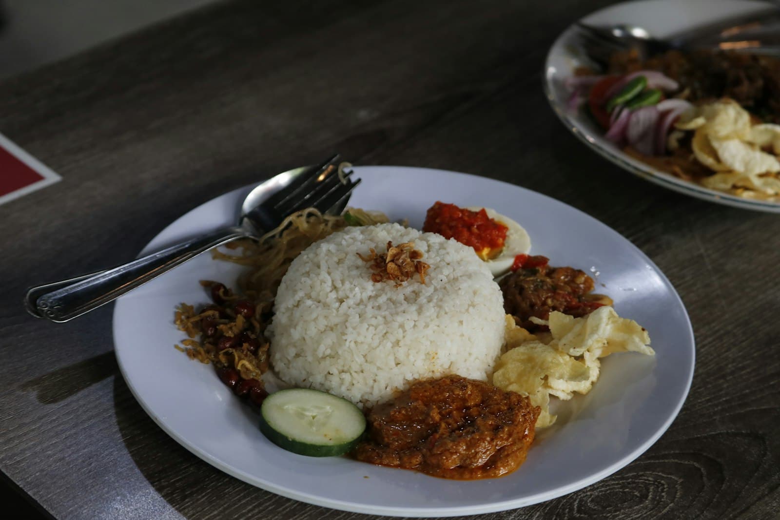 A full Indonesian rice plate with sambal and sides